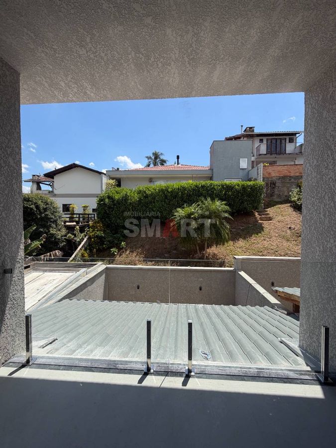 Geminado alto padrão novo com 3 suítes e fundos com churrasqueira e pergolado
