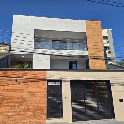 Casa 3 suítes em Jardim Guanabara, Rio de Janeiro: design moderno com piscina e área gourmet