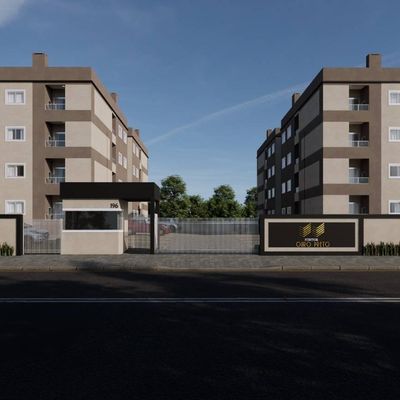 Prédio residencial com duas torres de apartamentos, portaria e cerca.